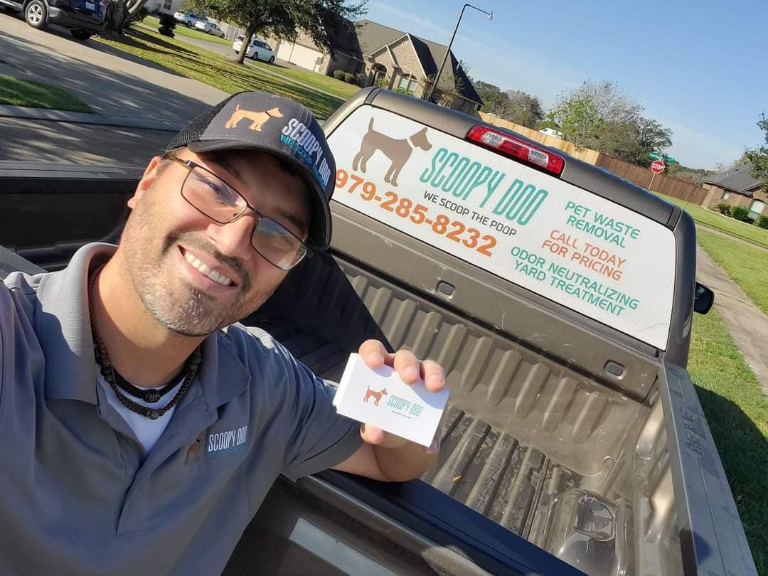 Daniel's Dog Doody team serving a residential yard